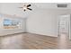 Spacious bedroom with vaulted ceilings, ceiling fan, wood-look floors and plenty of natural light at 154 Six Mile Creek Dr., Georgetown, SC 29440