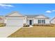 Charming single-story home with a two-car garage, brick accents, and a well-manicured lawn at 154 Six Mile Creek Dr., Georgetown, SC 29440