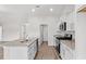 Modern kitchen with granite countertops, stainless steel appliances, and an island with a sink at 154 Six Mile Creek Dr., Georgetown, SC 29440