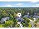 Stunning aerial view of the neighborhood, showcasing lush greenery and well-maintained properties at 154 Windsor Circle Sw, Ocean Isle Beach, NC 28469