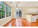 Bright dining room features large windows, tiled floor, and access to the outdoor deck at 154 Windsor Circle Sw, Ocean Isle Beach, NC 28469