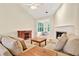 Inviting living room featuring a fireplace, hardwood floors, and comfortable couches, and ample natural light at 154 Windsor Circle Sw, Ocean Isle Beach, NC 28469