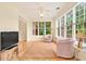 Inviting living room boasts hardwood floors, large windows, and comfortable seating at 154 Windsor Circle Sw, Ocean Isle Beach, NC 28469