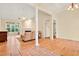 Bright living room with hardwood floors, a fireplace, and a large window for plenty of natural light at 154 Windsor Circle Sw, Ocean Isle Beach, NC 28469
