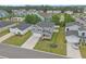 Aerial view of the home showcasing the manicured lawn, driveway, and neighborhood at 155 S Reindeer Rd., Surfside Beach, SC 29575