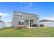 Two-story home featuring a spacious backyard with a patio area, perfect for entertaining and relaxing at 155 S Reindeer Rd., Surfside Beach, SC 29575