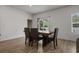Bright dining room with wood floors and view to backyard at 155 S Reindeer Rd., Surfside Beach, SC 29575