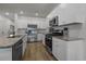Modern kitchen boasts stainless appliances, sleek countertops, and ample cabinet space at 155 S Reindeer Rd., Surfside Beach, SC 29575