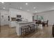 Bright kitchen with an island, granite countertops, and a seamless transition to the dining area at 155 S Reindeer Rd., Surfside Beach, SC 29575