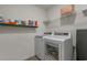 Modern laundry room with side-by-side washer and dryer and laminate flooring at 155 S Reindeer Rd., Surfside Beach, SC 29575