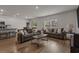 Spacious living room with wood floors, neutral walls, and open floor plan to kitchen at 155 S Reindeer Rd., Surfside Beach, SC 29575