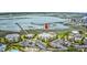 Aerial view of condo complex near the bay with parking and surrounding trees at 1582 S Waccamaw Dr. # 34, Garden City Beach, SC 29576