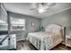 Inviting bedroom with a queen-sized bed, ceiling fan, and a bright window view at 1582 S Waccamaw Dr. # 34, Garden City Beach, SC 29576