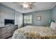 Comfortable bedroom with a queen-sized bed, ceiling fan, and a view of the outdoors at 1582 S Waccamaw Dr. # 34, Garden City Beach, SC 29576
