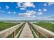 Picturesque wooden boardwalk and waterfront views showcasing the natural beauty and waterfront appeal at 1582 S Waccamaw Dr. # 34, Garden City Beach, SC 29576