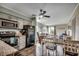 Open kitchen featuring stainless steel appliances, gray cabinets, and a dining area at 1582 S Waccamaw Dr. # 34, Garden City Beach, SC 29576