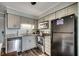 Eat-in kitchen features gray cabinets, stainless appliances and granite countertops at 1582 S Waccamaw Dr. # 34, Garden City Beach, SC 29576