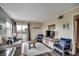 Relaxing living room featuring a cozy sofa, TV, and access to a balcony at 1582 S Waccamaw Dr. # 34, Garden City Beach, SC 29576