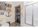 Well lit bathroom features a shower, toilet, vanity, and stackable washer and dryer at 1614 Cottage Cove Circle, North Myrtle Beach, SC 29582