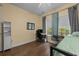 Inviting bedroom features hardwood floors, a desk, natural light, and neutral paint at 1614 Cottage Cove Circle, North Myrtle Beach, SC 29582