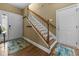 The entryway has beautiful hardwood floors and features a staircase and multiple entryways at 1614 Cottage Cove Circle, North Myrtle Beach, SC 29582