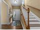 Inviting entryway features hardwood floors, staircase with white risers, and a colorful accent rug at 1614 Cottage Cove Circle, North Myrtle Beach, SC 29582