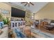 Comfortable living room featuring a large TV, coastal decor, and vaulted ceilings at 1614 Cottage Cove Circle, North Myrtle Beach, SC 29582