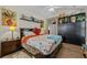 Vaulted ceiling bedroom boasts a large bed, wood floors, and storage at 1614 Cottage Cove Circle, North Myrtle Beach, SC 29582