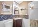 Charming bathroom with unique tile accents, decorative mirror, and updated fixtures at 1894 Athens Dr., Conway, SC 29526