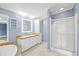 Well-lit bathroom featuring a double sink vanity, framed mirror, and a glass door shower at 1894 Athens Dr., Conway, SC 29526