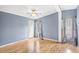 Bedroom features wood floors, ceiling fan, and great natural light from the windows at 1894 Athens Dr., Conway, SC 29526