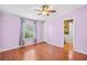 Comfortable bedroom featuring wood floors, a ceiling fan, and natural light from the window at 1894 Athens Dr., Conway, SC 29526
