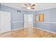 Bedroom features wood floors, ceiling fan, and an open door to the hall at 1894 Athens Dr., Conway, SC 29526