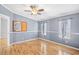 Bedroom features a ceiling fan, hardwood floors, and a bulletin board at 1894 Athens Dr., Conway, SC 29526