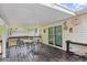 Covered deck with dark wood floors, railings, furniture, and access to the home's interior at 1894 Athens Dr., Conway, SC 29526