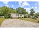 Single-story home with a large front yard and a long driveway at 1894 Athens Dr., Conway, SC 29526