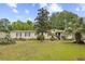 Charming single-story home with a well-manicured lawn and mature trees, creating a welcoming curb appeal at 1894 Athens Dr., Conway, SC 29526