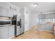 Charming kitchen featuring plentiful cabinetry, stainless steel refrigerator, and a seamless transition to the living spaces at 1894 Athens Dr., Conway, SC 29526