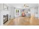 Inviting living room with wood floors, fireplace, and an open layout to the kitchen at 1894 Athens Dr., Conway, SC 29526