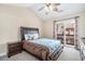 Comfortable bedroom featuring a ceiling fan and sliding door access to balcony at 2101 Firebird Ln. # 14, Myrtle Beach, SC 29577