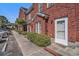 Close-up view of a brick townhouse with a manicured lawn at 2101 Firebird Ln. # 14, Myrtle Beach, SC 29577