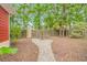 Backyard features a garden with greenery, and a wooden privacy fence at 212 Greenwich Dr., Conway, SC 29526