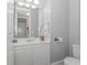 Powder room features a white vanity with a mirror and a toilet at 212 Greenwich Dr., Conway, SC 29526