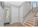 Foyer with a stairway to the upper level, a front door, and a side door at 212 Greenwich Dr., Conway, SC 29526