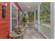 Covered front porch with slate tile, white railing, bench and decor at 212 Greenwich Dr., Conway, SC 29526