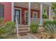 Close-up of front porch with brick steps, detailed door, and decor at 212 Greenwich Dr., Conway, SC 29526