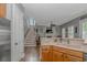 An open floor plan showcases a living room with a fireplace and a staircase at 212 Greenwich Dr., Conway, SC 29526