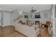 Cozy living room with fireplace, stairs, ceiling fan and neutral decor at 212 Greenwich Dr., Conway, SC 29526