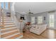 Bright living room with fireplace, stairs, and views to the front yard at 212 Greenwich Dr., Conway, SC 29526