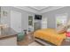 A main bedroom features a doorway to the main bathroom and a large television at 212 Greenwich Dr., Conway, SC 29526